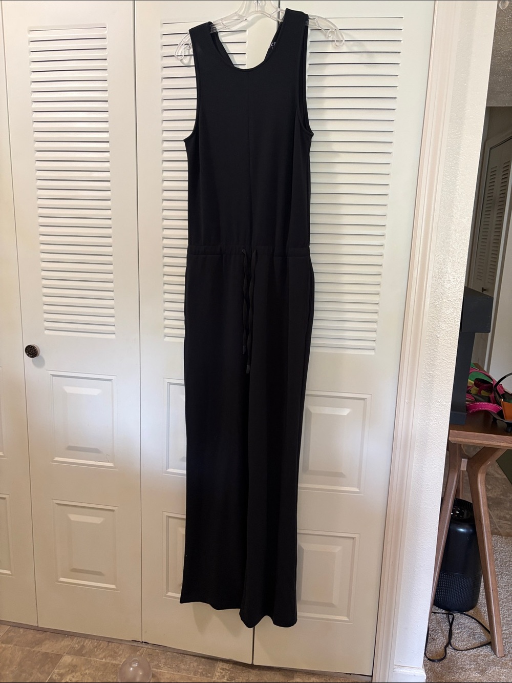 Classic Knit Black Sleeveless Jumpsuit.  Ties at the waist,one button back close